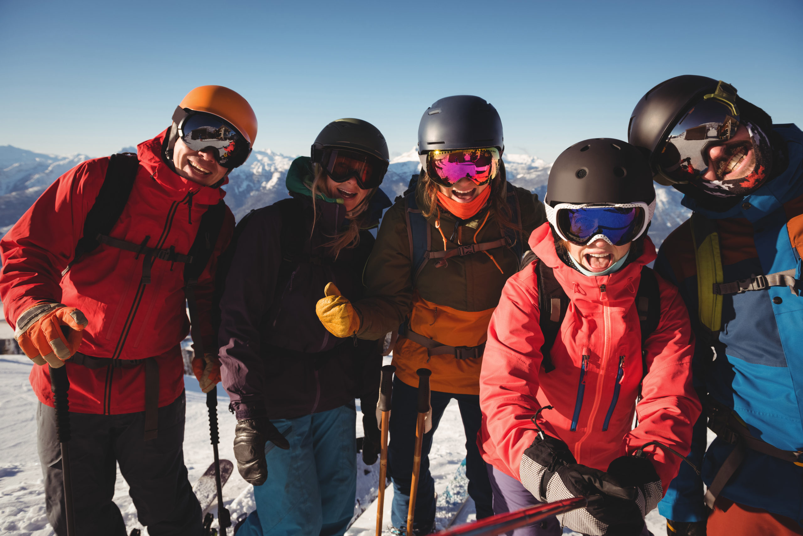 Group of skiers having fun in ski resort during winter